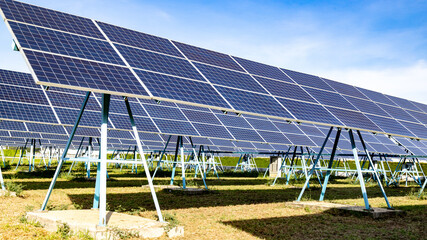 Blue solar panels on sky background. Solar power plant. Solar farm, Alternative source of...