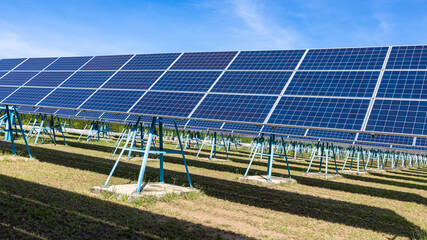 Blue solar panels on sky background. Solar power plant. Solar farm, Alternative source of...