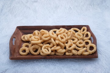 Butter murukku – also known as benne murukku, benne chakli or venna murukku. Murukku is a deep fried crisp snack made with rice flour and gram flour. Indian Tamil Traditional Tea Time Snack.