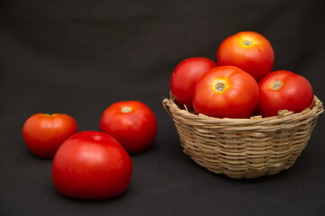 closeup of a red tomato isolated on a black studio background, Tomato isolated. Tomatoes on black...