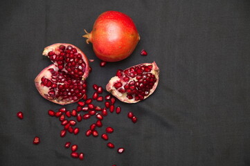 Group of pomegranates, Fresh ripe pomegranate seeds with cut in half, Delicious red ripe juicy pomegranate seed, Artistic Close up Macro, Tropical open Pomegranate with seeds.