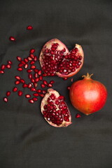 Group of pomegranates, Fresh ripe pomegranate seeds with cut in half, Delicious red ripe juicy pomegranate seed, Artistic Close up Macro, Tropical open Pomegranate with seeds.