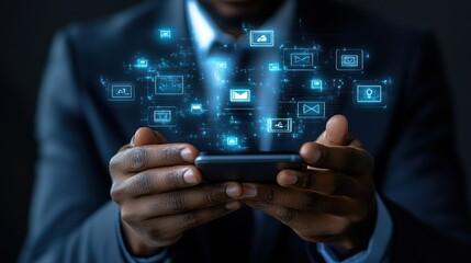 Businessman holds phone, digital icons emanate