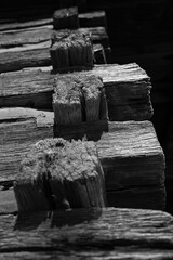 A black and white photo looking up the outside corner of a log cabin in Chickamauga Battlefield,...