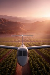 Small airplane flying over vineyard at sunset with mountain range in background and warm light creating peaceful atmosphere