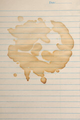 light brown coffee or tea stains on piece of lined paper, cafe drink beverage spill or trace, taken from above with copy space