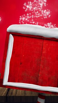 Animation of road sign with copy space over snow falling and glowing spots on red background