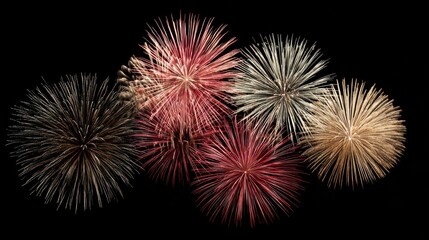Multiple firework bursts in red, white, and gold symmetrically arranged on a clean black background.