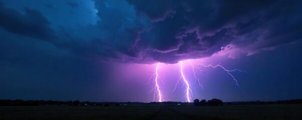 Intense Lightning Strike Illuminates Dramatic Nighttime Thunderstorm over Distant Landscape