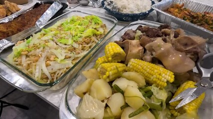 Enjoying traditional Filipino food at a family gathering in the Philippines. Tasty Filipino dishes served at a lively family gathering showcasing local flavors.