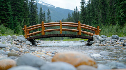 Tranquil wooden bridge over a clear stream in a lush green forest, with mountains and cloudy sky in the background, nature inspiring serenity and peace