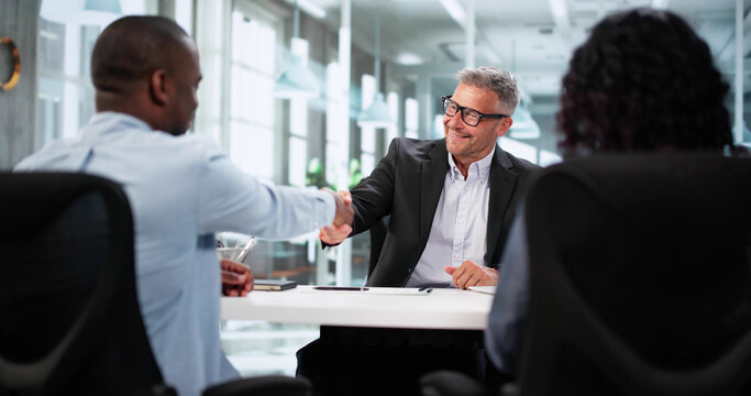 Happy Young Couple Meets Financial Advisor