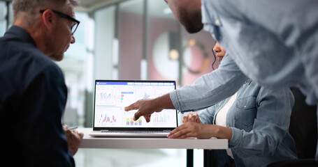 Predictive Analytics Meeting: Diverse Team Analyzing Market Performance