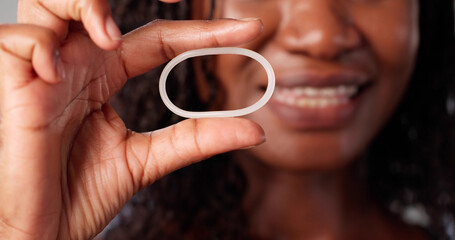 Young African-American Woman Consulting Doctor About Contraceptive Birth