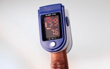 African American Woman Having Oximeter Check Blood Oxygen.