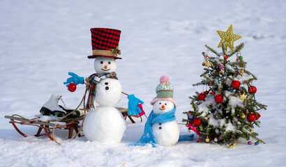 Funny snowman in winter background. Snowman in winter holiday. Decorated snowman. Greeting card for...