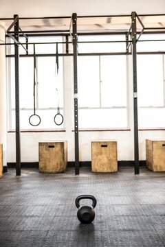 Fototapeta Minimalist gym illustration is featuring flat design pull-up rig, kettlebell, rings and plyo boxes