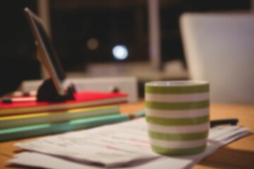 Coffee cup over papers by digital tablet © vectorfusionart