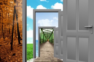 Open doors with bridge and trees