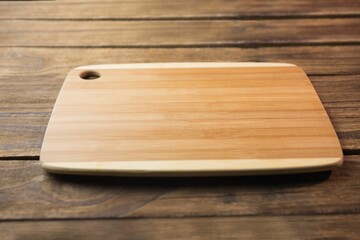 Close-up of wooden chopping board on hardwood floor