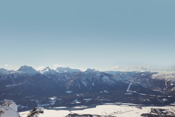 Three skiers relaxing on snow landscape
