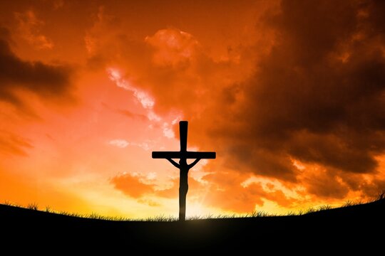 Fototapeta Cross religion symbol shape over sunset sky