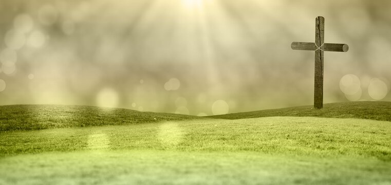 Fototapeta Solitary wooden cross is standing on green rolling hills in flat design with soft sun rays