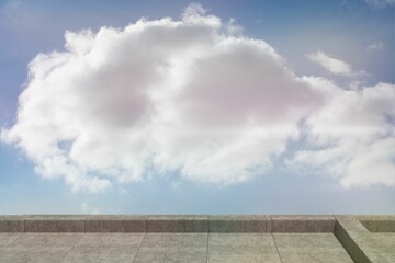 Fototapeta premium Large cumulus cloud floating above stone-tiled terrace under clear blue sky in flat vector design