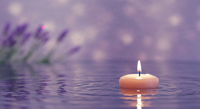 Floating candle in water with lavender in soft purple background - Powered by Adobe