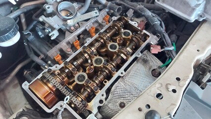 Vehicle repair showing bumper replacement, air filter service, engine components, piston and gasket...