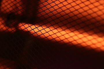 Abstract Bright Grid Pattern with Warm Orange Light Effect. Domestic electric heater