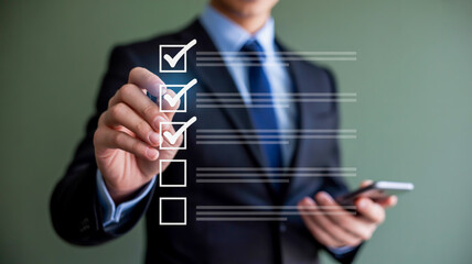 A person in a dark suit with blue tie interacts with a floating virtual checklist, checking boxes against a blurred greenish-gray background