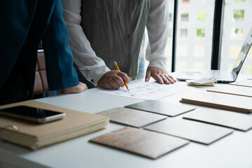 Interior Designer Consulting with Client on Material Selection