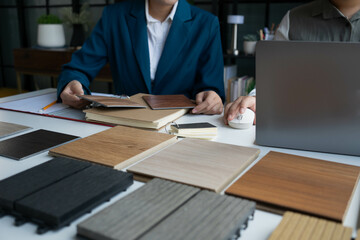Interior Designer Consulting with Client on Material Selection