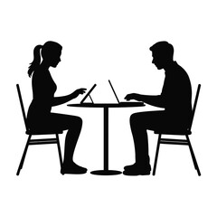 Two people silhouetted working on laptops at a round table