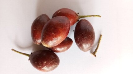 Sawo kecik (Manilkara kauki, Javanese sapodilla) isolated on white background. Planted as an ornamental plant and the fruit is very delicious.