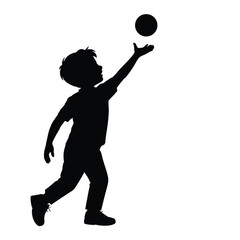 Silhouette of a young boy reaching up to catch a ball
