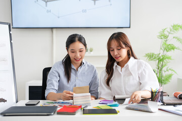 Woman architect designer select material compare samples finishing. Female interior creator...