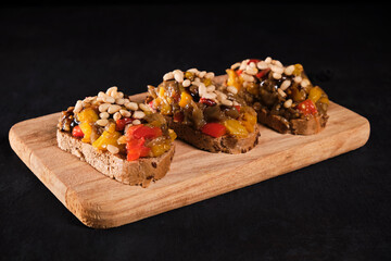 Assorted bruschetta with various toppings.Appetizing bruschetta.Variety of small sandwiches.Mix bruschetta