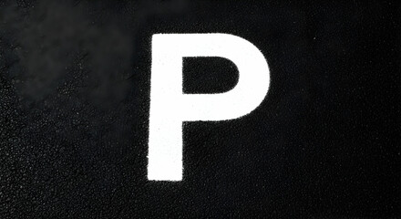 Painted Letter P On Dark Asphalt Surface Minimalist Urban Typography