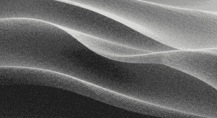 Abstract undulating sand dune texture with dramatic light and shadow patterns