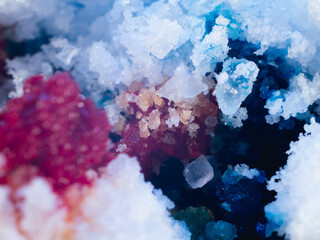 A close up of a rock with a blue and red color