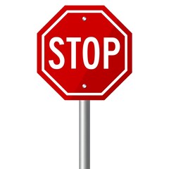 A red stop sign on a metal post isolated on white background