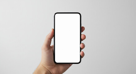 Hand holding a smartphone with a blank screen