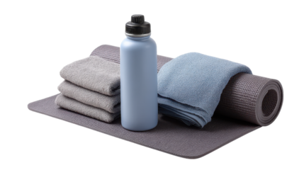 Yoga mat with rolled towels and water bottle isolated on transparent background