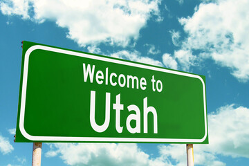 Welcome To Utah Green Road Sign at the entrance to the state.
