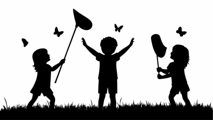 Silhouette of children playing with butterfly nets in a field of grass chasing butterflies happily outdoors