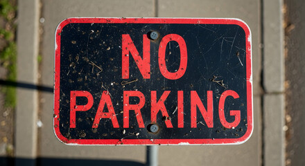 Worn Sign Prohibiting Parking On City Street With Scratches And Imperfections