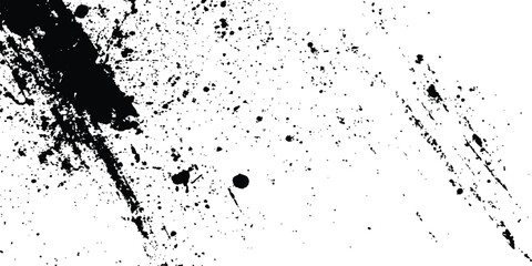 Abstract ink splatter background with black and white textures. A dynamic and chaotic effect, movement with different sizes of spots, splashes, drips, drops and smudges. Isolated on white background. 