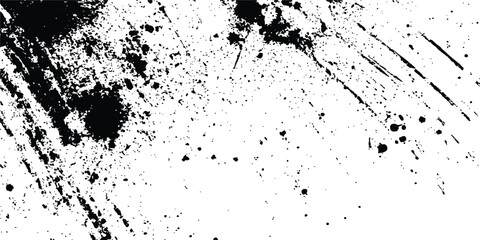Abstract ink splatter background with black and white textures. A dynamic and chaotic effect, movement with different sizes of spots, splashes, drips, drops and smudges. Isolated on white background. 